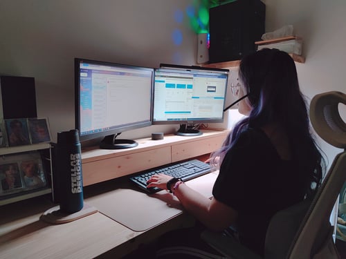 Team Member working at Computer with Headset
