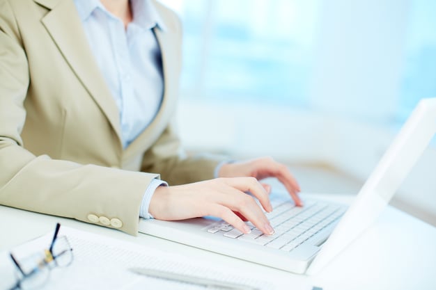 close-up-businesswoman-working-online